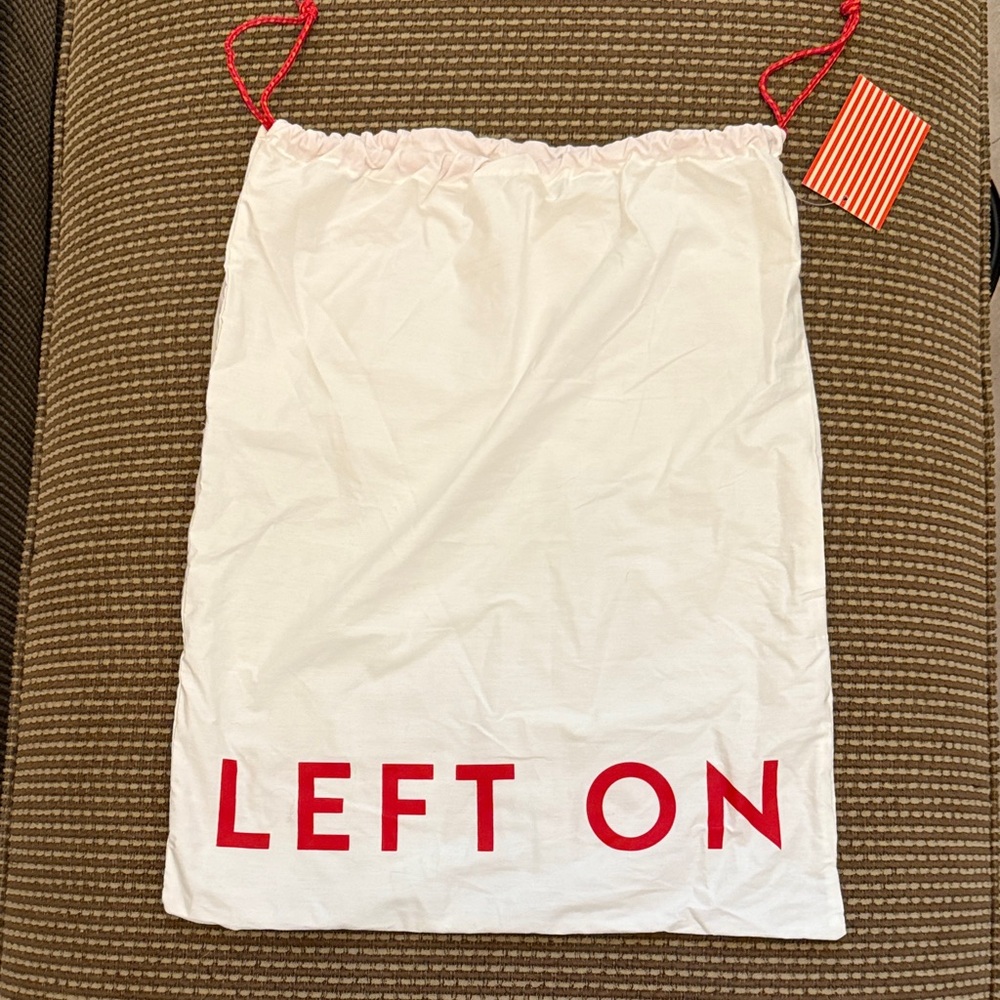 Left on Friday cinched bag white red